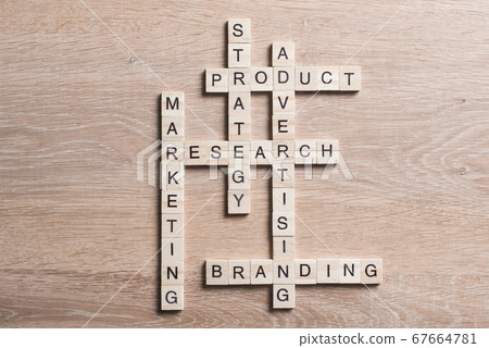 Conceptual business keywords on table with elements of game making crossword Conceptual business keywords on table with elements of game making crossword 67664781