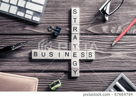 Conceptual business keywords on table with elements of game making crossword Conceptual business keywords on table with elements of game making crossword 67664784