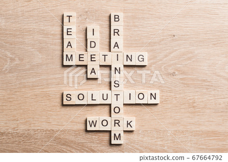 Conceptual business keywords on table with elements of game making crossword Conceptual business keywords on table with elements of game making crossword 67664792