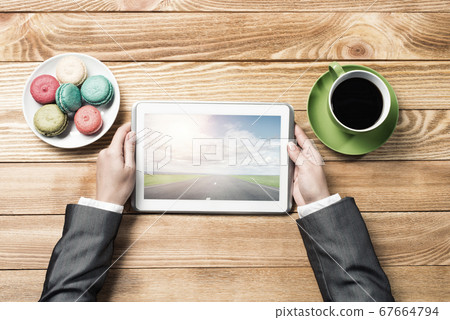 Businesswoman having coffee break Businesswoman having coffee break 67664794