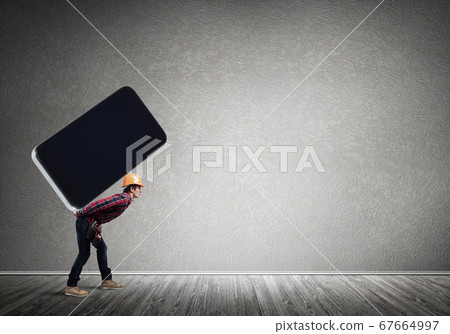 Builder man carry huge smartphone Builder man carry huge smartphone 67664997
