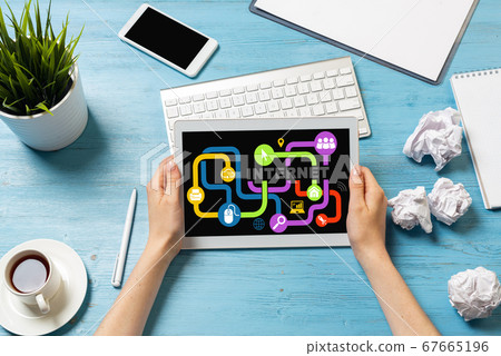 Freelancer sitting at desk and working with laptop Freelancer sitting at desk and working with laptop 67665196