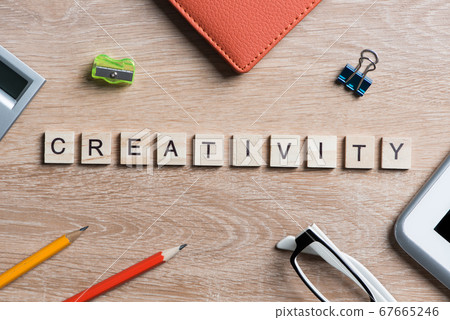 Game elements on wooden table spelling brainstorming and creative thinking idea Game elements on wooden table spelling brainstorming and creative thinking idea 67665246