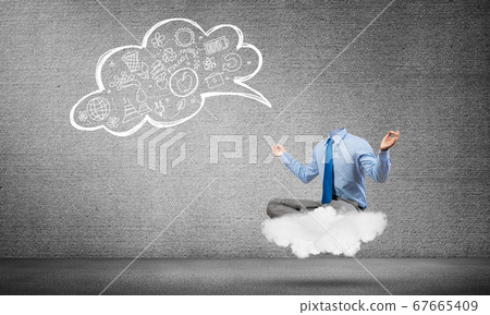 Headless businessman meditating 67665409