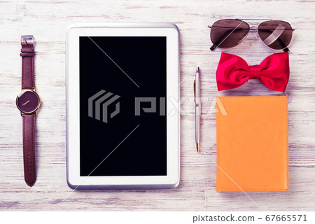 Gentleman kit of tablet watch glasses bow tie and notebook on wo 67665571