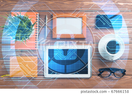 Business workplace with tablet pc and security concept on screen Business workplace with tablet pc and security concept on screen 67666158
