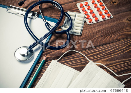 Desk of doctor with medicine things Desk of doctor with medicine things 67666448
