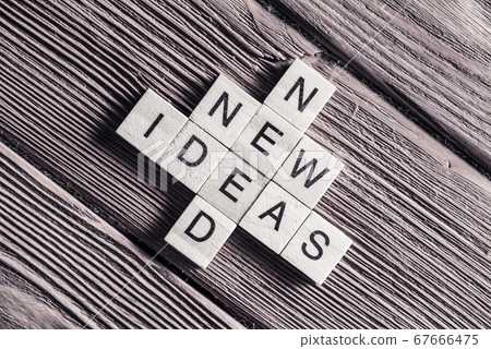 Conceptual keywords on wooden table with elements of game making crossword Conceptual keywords on wooden table with elements of game making crossword 67666475