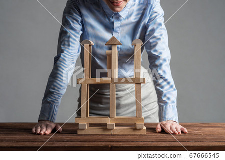 Business woman building construction on table 67666545