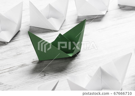Business leadership concept with white and color paper boats on 67666710