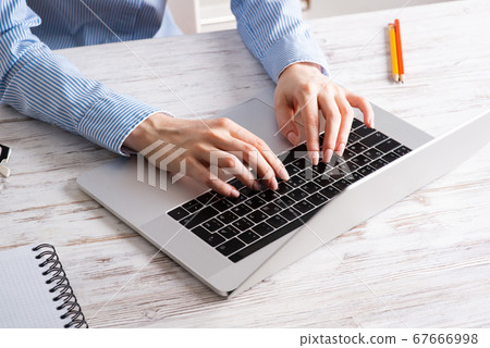 Close up business woman hands working at laptop Close up business woman hands working at laptop 67666998