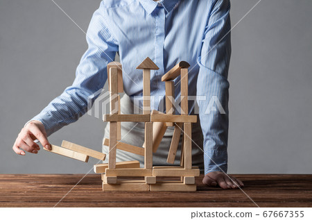 Business woman building construction on table Business woman building construction on table 67667355