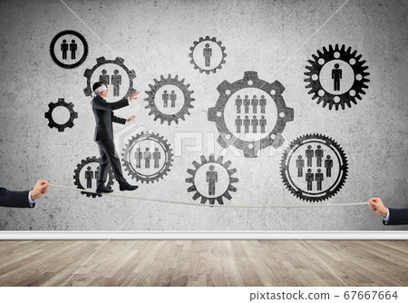 Business concept of risk support and assistance with man balancing on rope 67667664