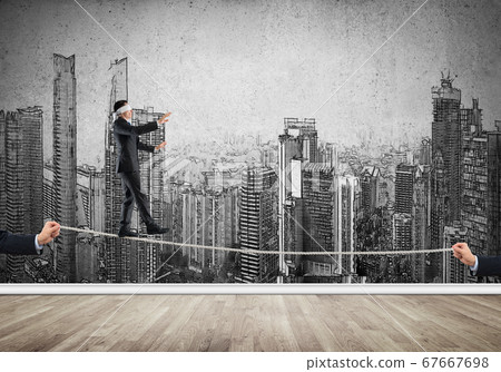 Business concept of risk support and assistance with man balancing on rope Business concept of risk support and assistance with man balancing on rope 67667698