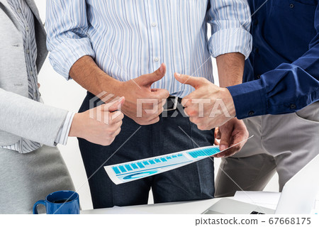 Group of business people showing thumbs up 67668175