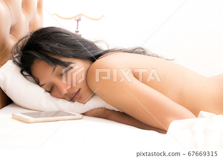 Beautiful Asian girl sleeping in the bed with Beautiful Asian girl sleeping in the bed with 67669315