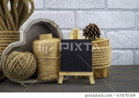 Assorted balls of hemp twine with rope and slate Assorted balls of hemp twine with rope and slate 67670384