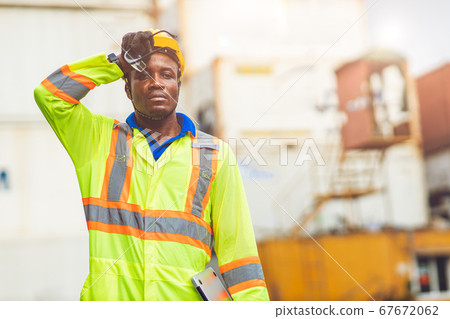 Tired stress worker sweat from hot weather in summer working in port goods cargo shipping logistic 67672062