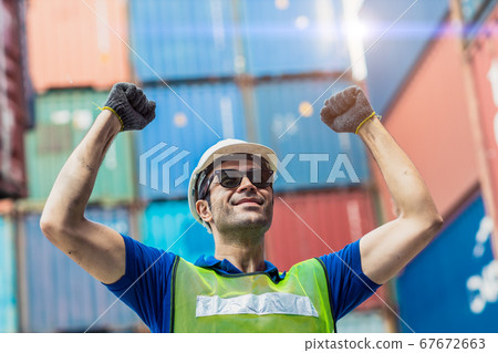 Happy Winner worker, Foreman shipping dock staff working at Container cargo harbor Rising hand Happy Winner worker, Foreman shipping dock staff working at Container cargo harbor Rising hand 67672663