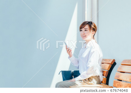 Business woman at the station Business woman at the station 67674048