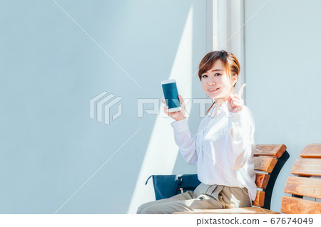 Business woman at the station 67674049