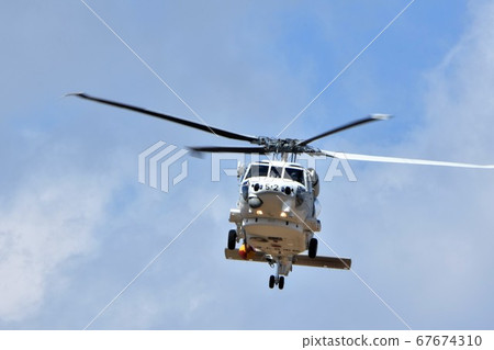 SH-60K patrol helicopter of the JMSDF flying in the sky SH-60K patrol helicopter of the JMSDF flying in the sky 67674310