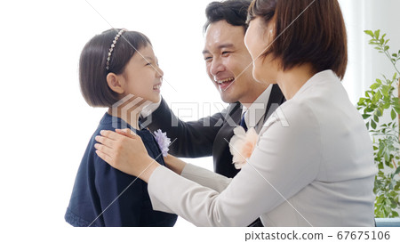 Family preparing for entrance ceremony 67675106