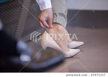 A woman riding a train 67675337