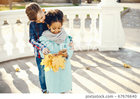 children in a park children in a park 67676640