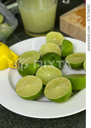 Half cut lemon on the white dish Half cut lemon on the white dish 67676692