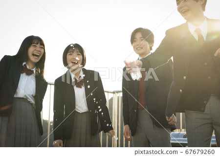 Student spending friends on the rooftop Student spending friends on the rooftop 67679260