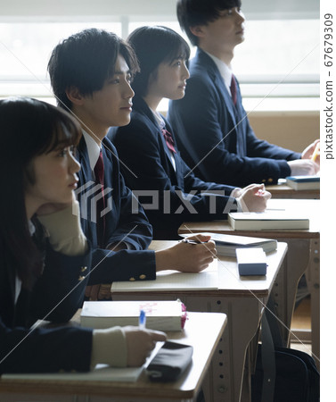Students studying in a classroom 67679309