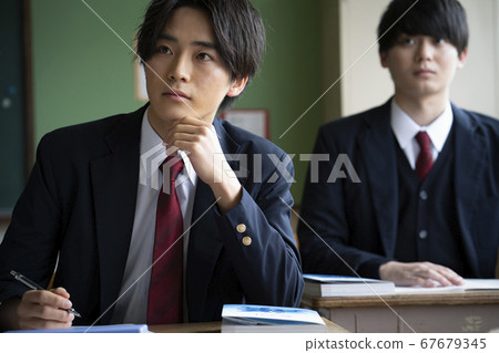 Students studying in a classroom 67679345