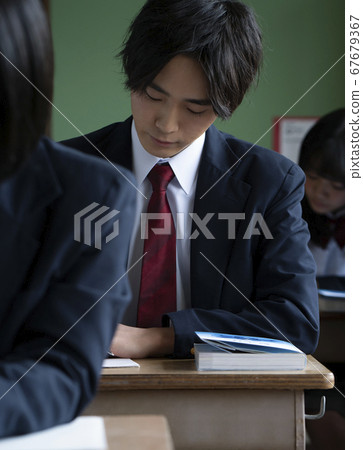 Students studying in a classroom Students studying in a classroom 67679367