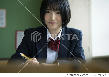 Students studying in a classroom 67679374