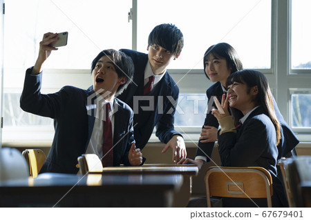 Students taking selfies in the classroom Students taking selfies in the classroom 67679401