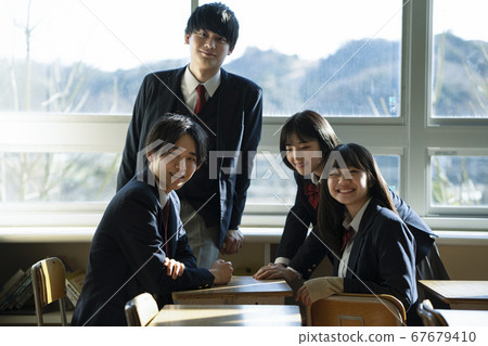 Students spending time with friends in the classroom Students spending time with friends in the classroom 67679410