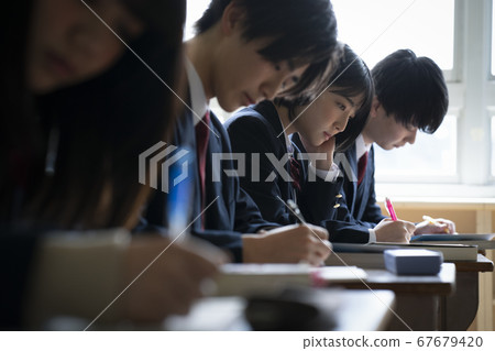 Students studying in a classroom Students studying in a classroom 67679420