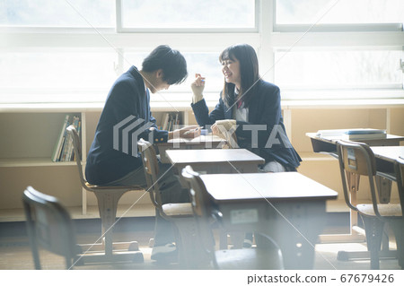 Students studying in a classroom 67679426