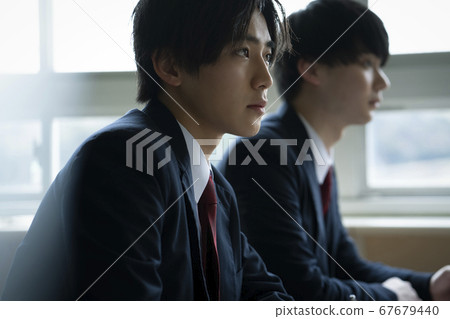 Students studying in a classroom 67679440