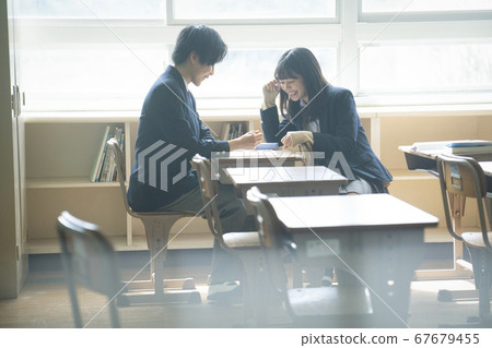 Students studying in a classroom 67679455