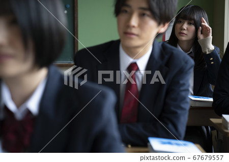 Students studying in a classroom 67679557