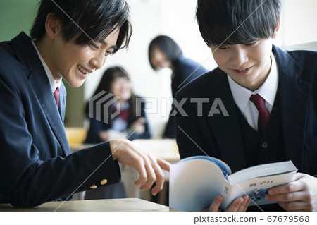Students studying in a classroom 67679568
