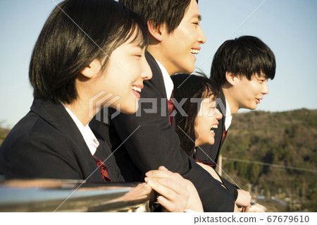 Student spending friends on the rooftop Student spending friends on the rooftop 67679610