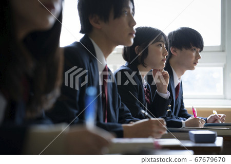 Students studying in a classroom 67679670