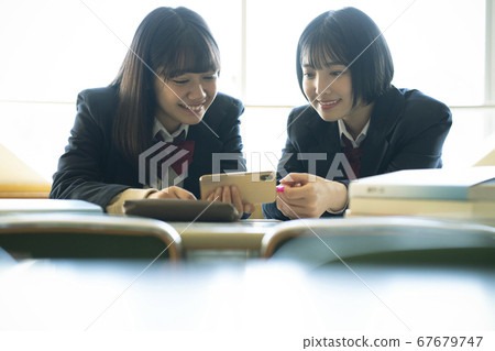 Students studying in the library 67679747