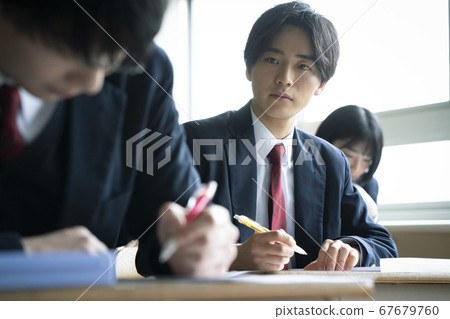 Students studying in a classroom 67679760