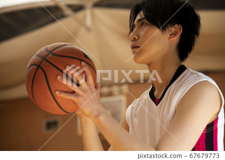 Men playing basketball Men playing basketball 67679773