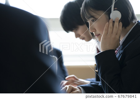Student studying with a computer Student studying with a computer 67679841