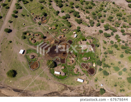 Aerial view of Maasai boma or family rural village on the coast of Salty lake Natron in the Great Rift Valley, Tanzania Aerial view of Maasai boma or family rural village on the coast of Salty lake Natron in the Great Rift Valley, Tanzania 67679844
